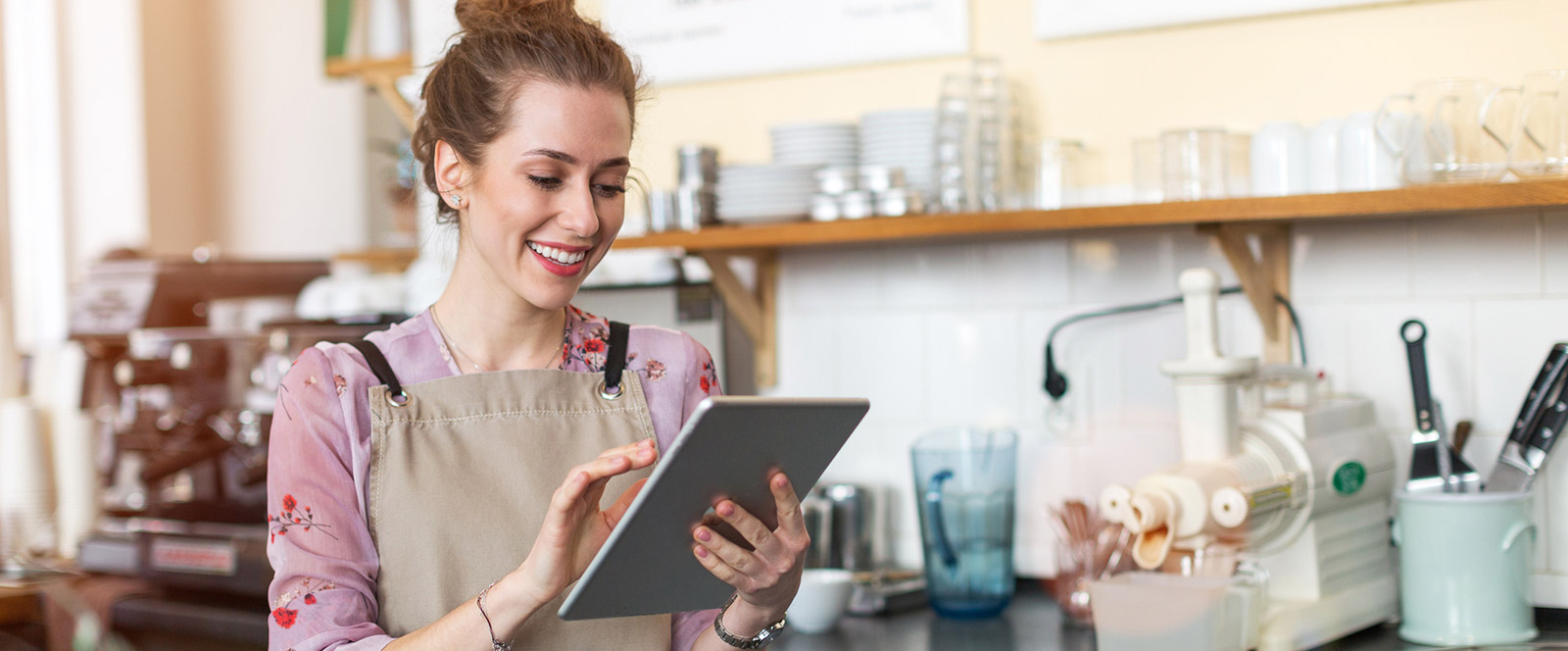 Business woman using tablet in shop