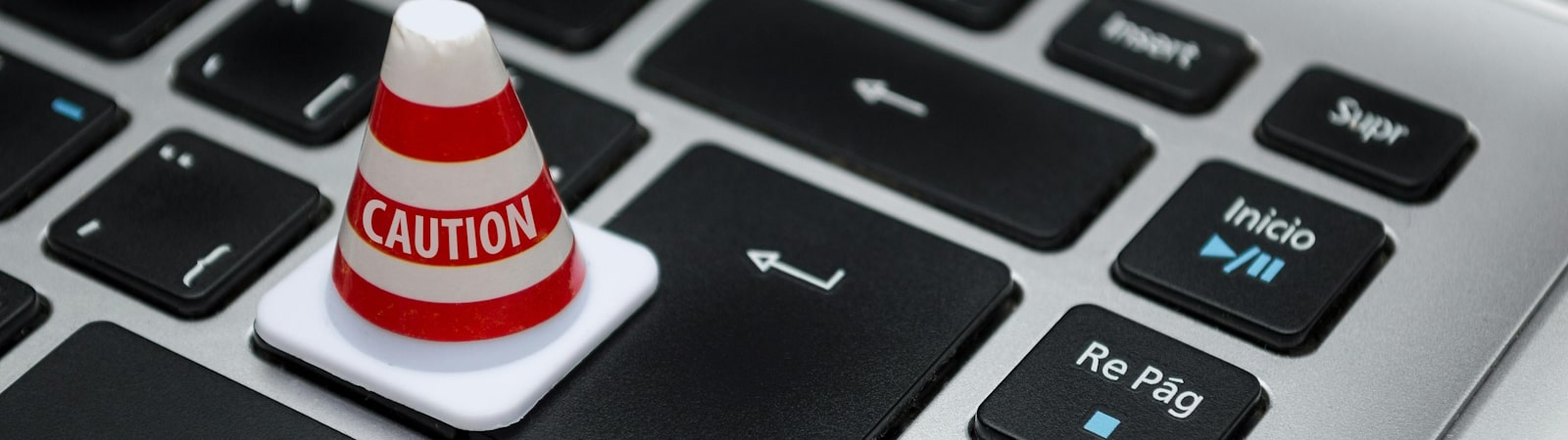 White caution cone on keyboard