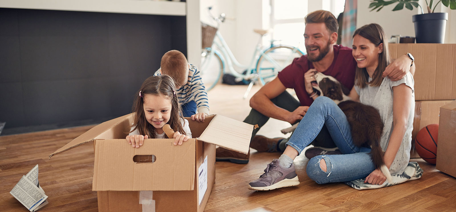 family playing with empty boxes